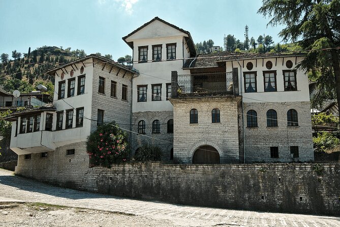Day Tour of Gjirokastra & Blue Eye from Tirana or Durres - Gjirokastra Castle above the stone roofs