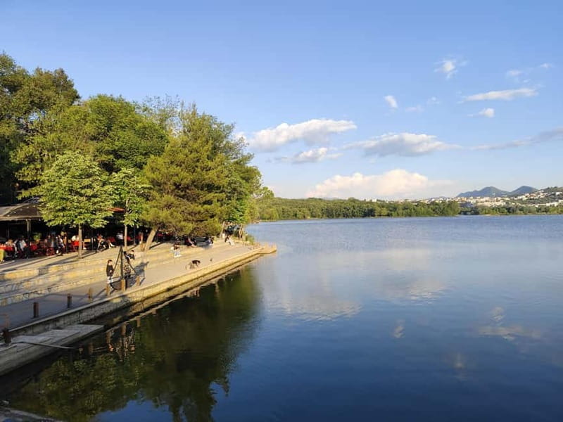 Discover Tirana: Panoramic Tour and Walk around the Artificial Lake - Reading Skanderbeg Square through its buildings