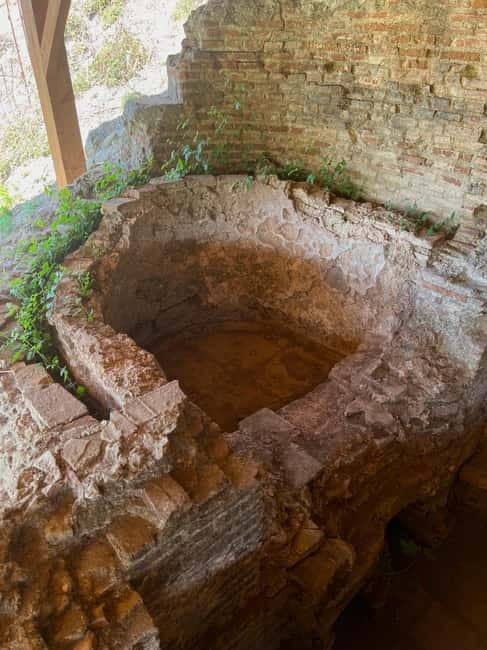 From Tirana: Berat City, Belshi Lake and Roman Baths Tour - Entering Berat Castle above the old city