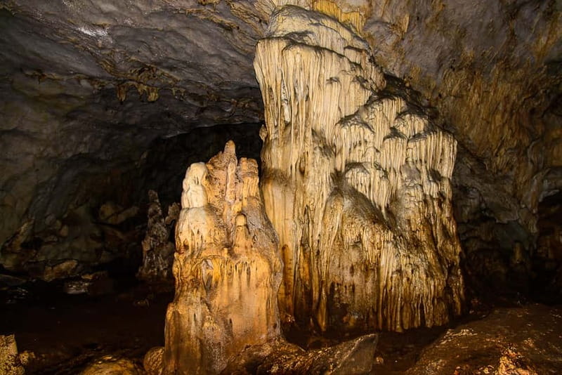 From Tirana: Hiking to Pellumbas Cave & visiting the Canyon - Entering a cave with Paleolithic roots