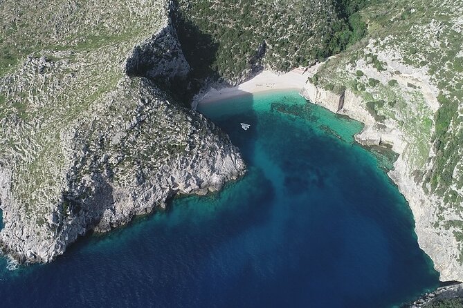 Speed Boat Tour to Vlore's Secret Blue Cave at Grama Bay - Englishman Bay: cliffs, clear water, and a longer swim