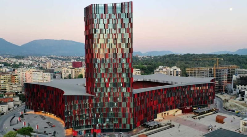 Tirana: Albania Stadium Guided Tour - Arriving at the glass-and-metal exterior