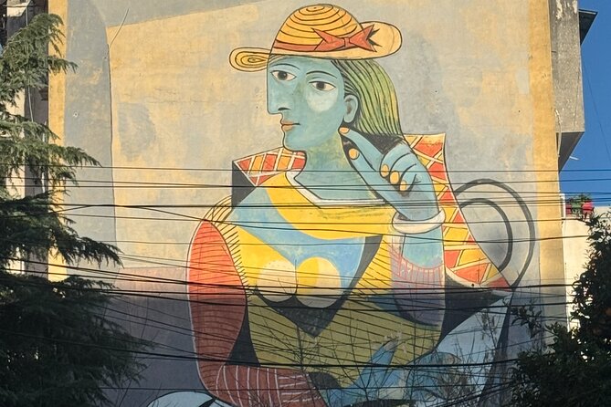Tirana Mural Bike Tour: Street Art, Culture & Photography Stops - DOG and Mots beside Kesulekuqja