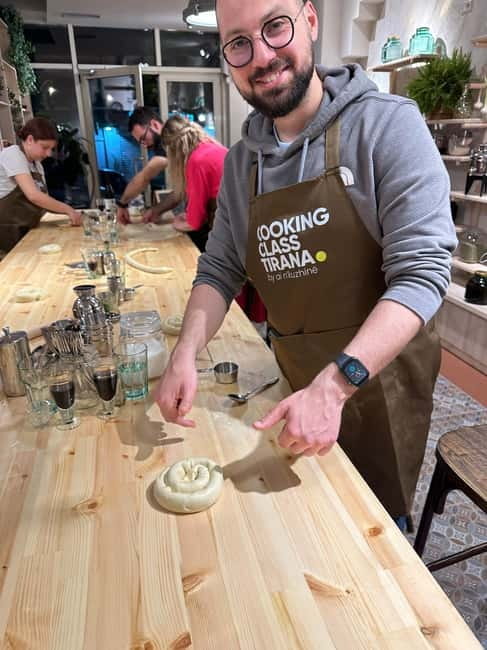Traditional Albanian Cooking Class in Tirana & Raki Tasting - Rolling burek dough with cottage cheese